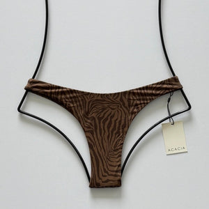 Front flat lay of Acacia Bodywear Oslo Lining Bikini Bottom in Neutral Mares featuring subtle zebra-inspired print.