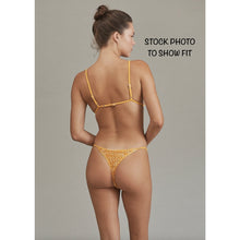Back view of model in Acacia Neema Crochet Bikini Bottom (stock photo for fit, in alternate color).