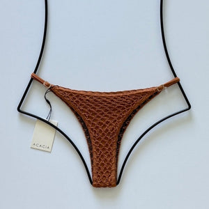 Back flat lay of Acacia Swimwear Neema Crochet Bikini Bottom in Tobacco with lining visible.