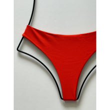 Close-up of Acacia Swimwear Brazil ribbed bikini bottom in persimmon orange – ribbed texture detail