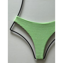 Close-up of ribbed terry texture fabric in light green.